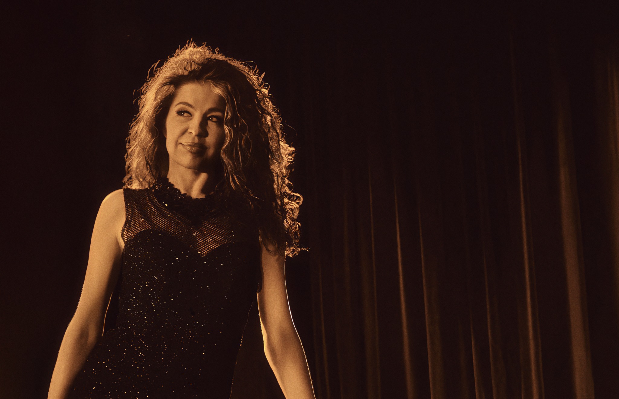 Portrait of Jaimee Paul representing the Bonded James Bond tribute concert